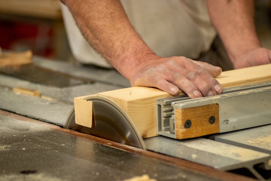 Carpenter building wood cabinets for a custom kitchen
